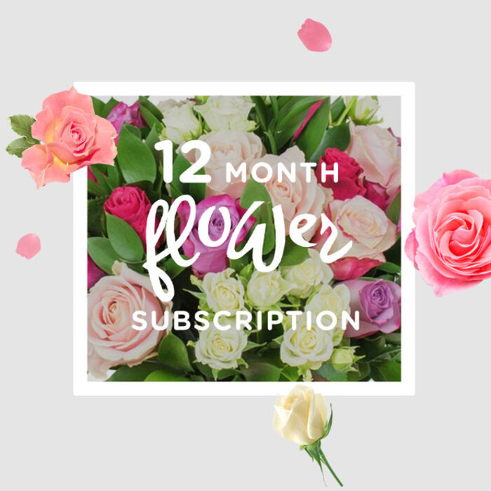 In this photograph, a lavish arrangement of roses becomes the visual anchor for the idea of twelve months of ongoing floral beauty. The bouquet forms a generous, rounded cluster, its surface a tapestry of rose heads in nuanced shades of pastel pink, warm cream, gentle lilac, and flashes of more intense fuchsia and raspberry. Each blossom is distinct: some roses are fully open, showing the intricate spiralling pattern of their petals, while others remain more closed, promising to unfurl in the days ahead, much like Reading's seasons gradually shifting along the towpaths by the Thames and the buzzing streets near Broad Street. The petals appear velvety and smooth, their edges soft and slightly curled, catching the light in a way that gives them a subtle sheen. Between the blooms, layers of glossy, deep green foliage provide structure and a natural frame, suggesting that the bouquet has been freshly arranged, stems snipped at an angle and leaves carefully snipped for a clean finish. The light is soft and flattering, with no harsh shadows, as if it streams through a nearby window in a Reading townhouse, gently illuminating the arrangement on a kitchen island or dining table. Around the central bouquet, scattered petals and smaller blossoms float across a creamy, uncluttered background, creating a sense of motion and playfulness, as though each month's bouquet arrives with its own little flurry of excitement. The composition invites not only visual appreciation but also an imagined sensory experience: the coolness of the petals under your fingertips, the faint rustle as the bouquet is placed in water, and the subtle perfume of roses gradually filling a room in Caversham, Tilehurst, or the town centre. It feels like a promise of continuity and care, perfectly suited to long-term gifting and everyday enjoyment alike.