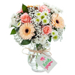 Overflowing with soft pastel blooms, this radiant bouquet captures the gentle spirit of Reading and is designed for moments of appreciation and connection. The rounded arrangement is dominated by blushing peach-pink roses, their silken petals gently unfurling like the first light over Abbey Ruins. Bright, uplifting gerbera daisies in shades of peach and light orange punctuate the display, their faces aglow with cheerful energy and deep, expressive centers. Clouds of white baby's breath intermingle with fluffy white chrysanthemums, each with a lively green center, lending the bouquet a luxurious texture and subtle vibrance. Sparse, deep green eucalyptus leaves add texture while suggesting the restful greenery found in Reading's parks and gardens. All stems rest snuggly in a clear glass vase with a subtle, artisan finish, their vibrant greens visible through the water, grounding the arrangement in freshness. A rustic length of twine graces the vase's neck, tied in a simple bow, from which a small, white card awaits a name or brief note. Every element-from colour balance to natural materials-reflects the care and artistry of local florists. This bouquet radiates warmth and gentle celebration, ideal for marking special moments, sending comfort, or brightening a loved one's day with same-day delivery from a trusted Reading flower designer.